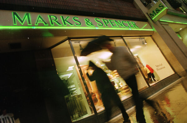 Marks and Spencer logo seen on an advertisement outside of a store in London