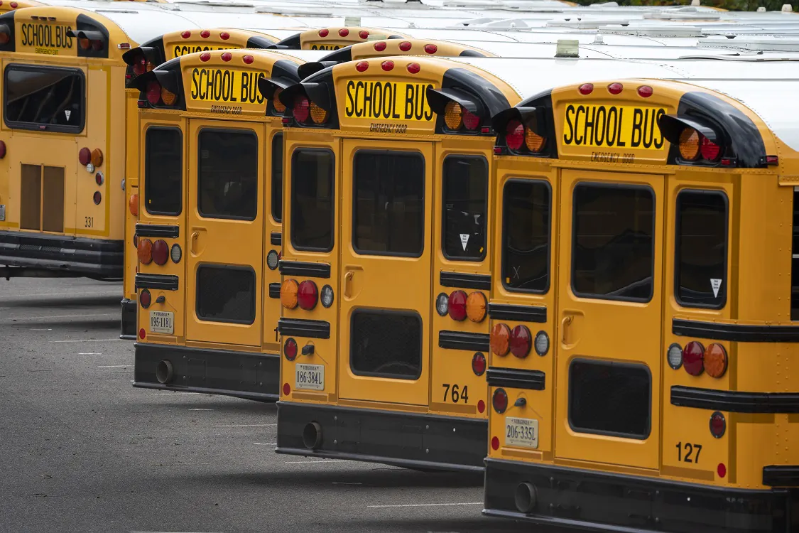 Fairfax County public school buses are lined up at a maintenance facility in Lorton, Va., on July 24, 2020. (J. Scott Applewhite/AP Photo)