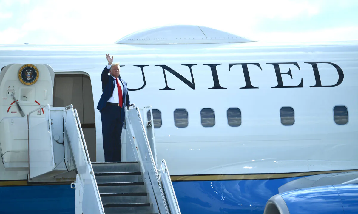 President Donald Trump waves from Air Force One after delivering remarks on the economy at an airport hangar in Oshkosh, Wis., on Aug. 17, 2020. (Brendan Smialowski/AFP via Getty Images)