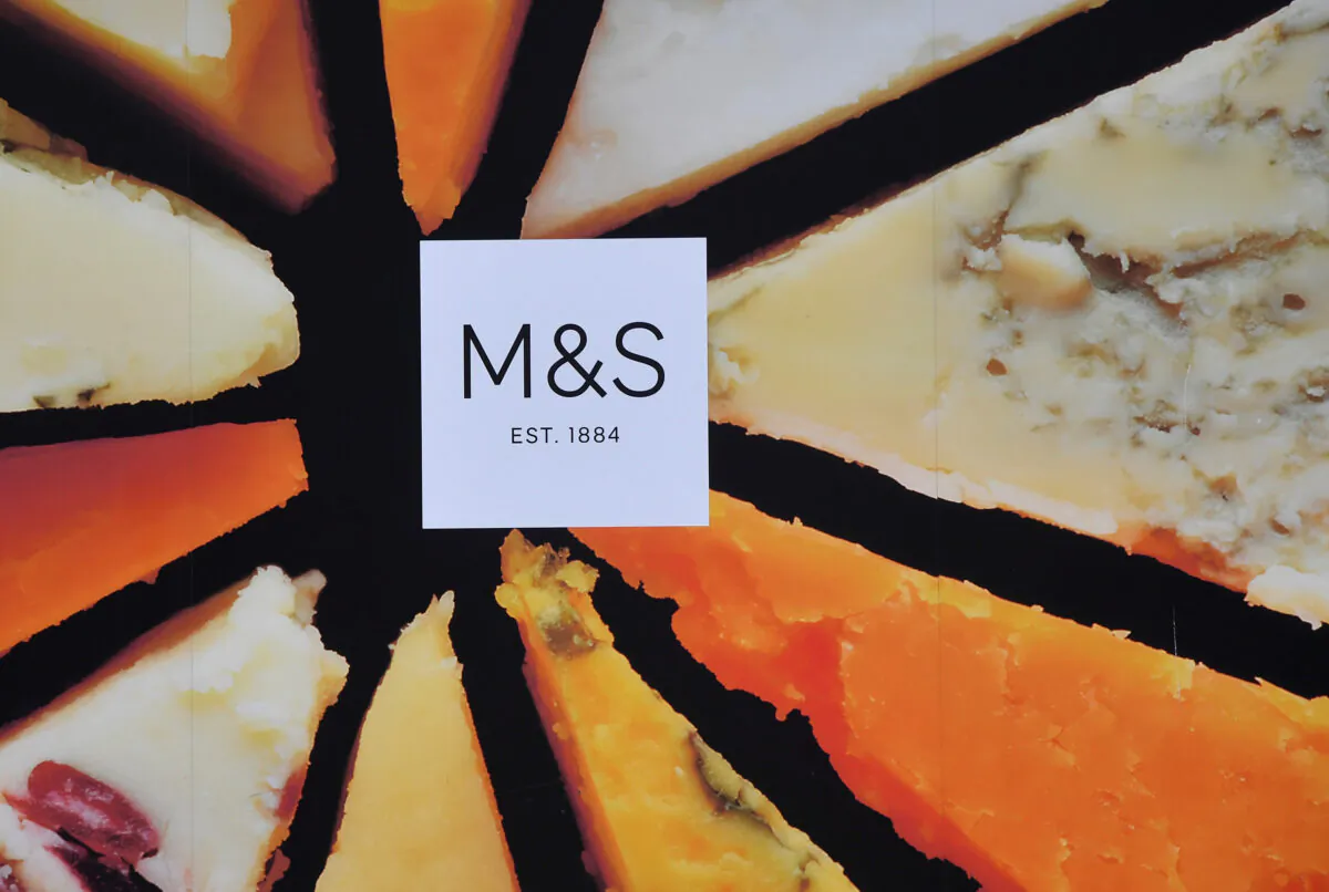 File photo showing a Marks and Spencer logo seen on an advertisement outside a store in London on May 23, 2018. (Reuters/Toby Melville)
