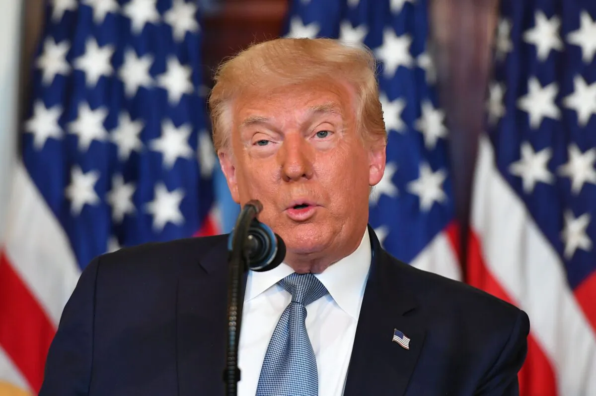 President Donald Trump speaks as he takes part in the signing of a proclamation on the 100th anniversary of the ratification of the 19th Amendment in the White House in Washington on Aug. 18, 2020. (Mandel Ngan/AFP via Getty Images)