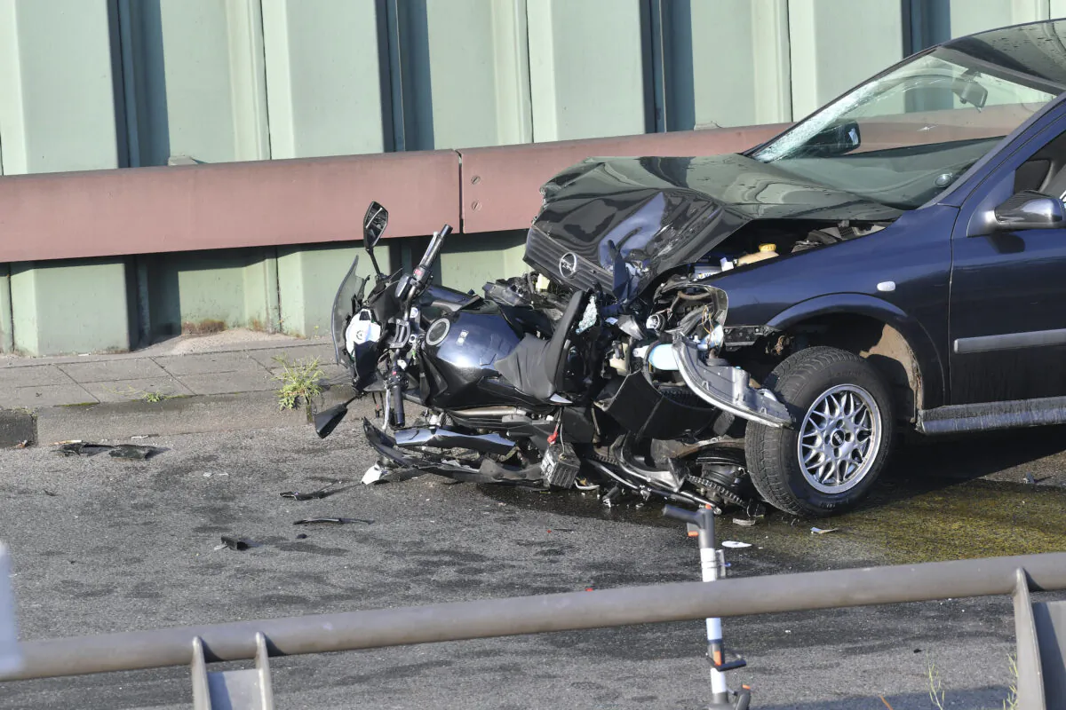 A car and a motorcycle stand on the city motorway A100 after an accident in Berlin,  on Aug. 19, 2020. (Paul Zinken/dpa via AP Photo)