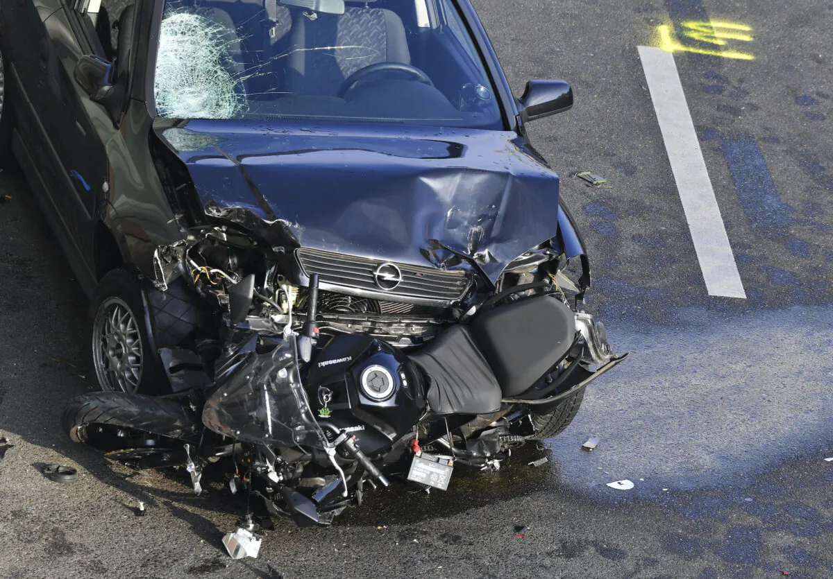 A car and a motorcycle stand on the city motorway A100 after an accident in Berlin, Germany, on Aug. 19, 2020. (Paul Zinken/dpa via AP Photo)