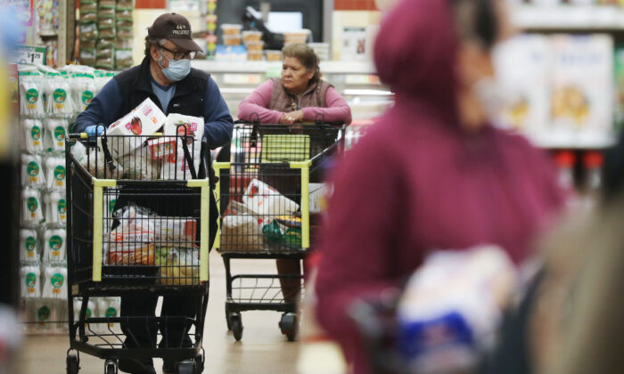 Seniors shop for groceries during special hours open to seniors and the disabled at Northgate Gonzalez Market, a Hispanic specialty supermarket, in Los Angeles, Calif., on Mar. 19, 2020. (Mario Tama/Getty Images)