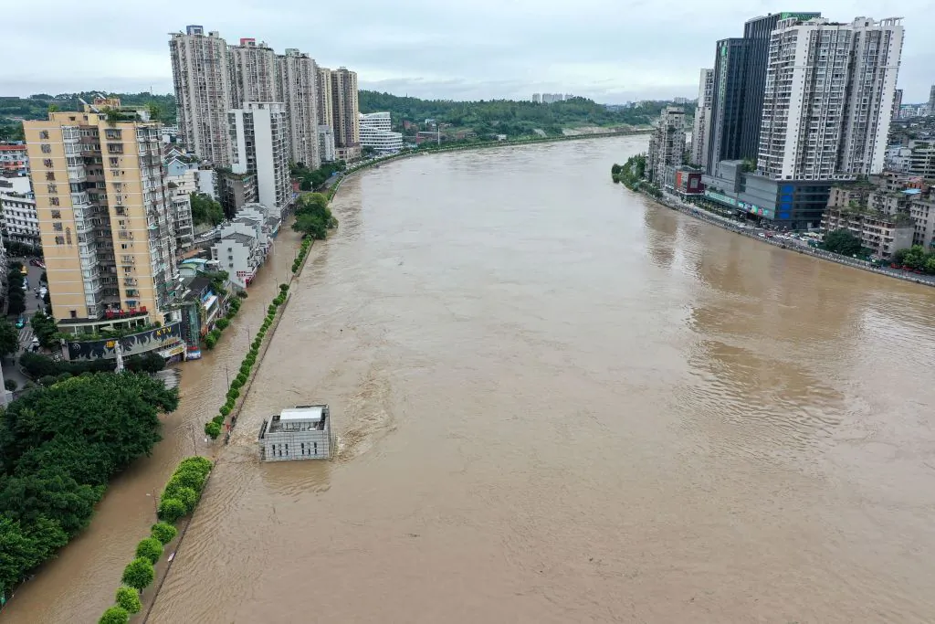 The swollen Tuojiang River following heavy rain in Neijiang in southwestern China's Sichuan Province on Aug. 18, 2020. (STR/AFP via Getty Images)
