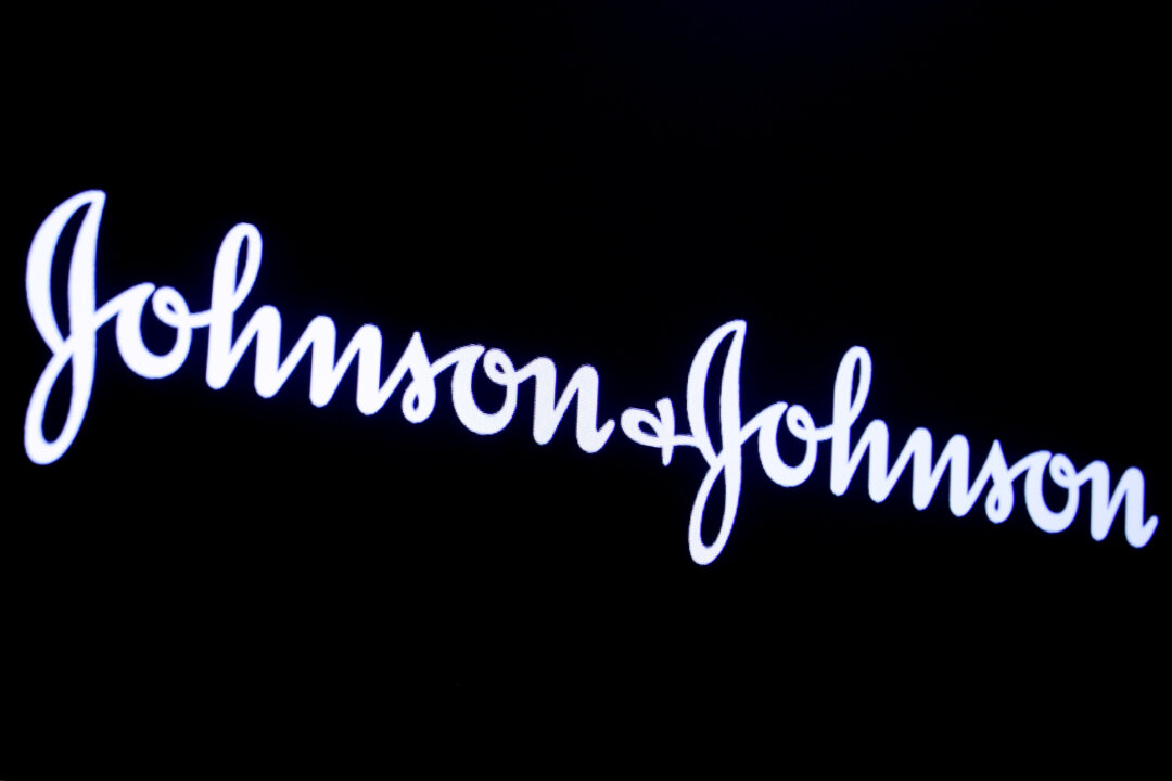 The company logo for Johnson and Johnson is displayed on a screen to celebrate the 75th anniversary of the company's listing at the New York Stock Exchange (NYSE) in New York City, on Sept. 17, 2019. (Brendan McDermid/Reuters/File Photo)