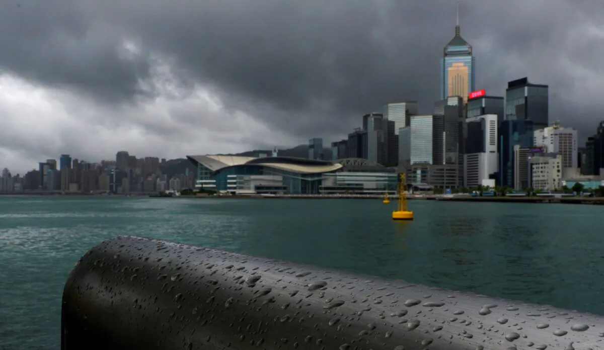Rain droplets line a railing along the waterfront of Victoria Harbour in Hong Kong, China, on Aug. 19, 2020. (Vincent Yu/AP Photo)