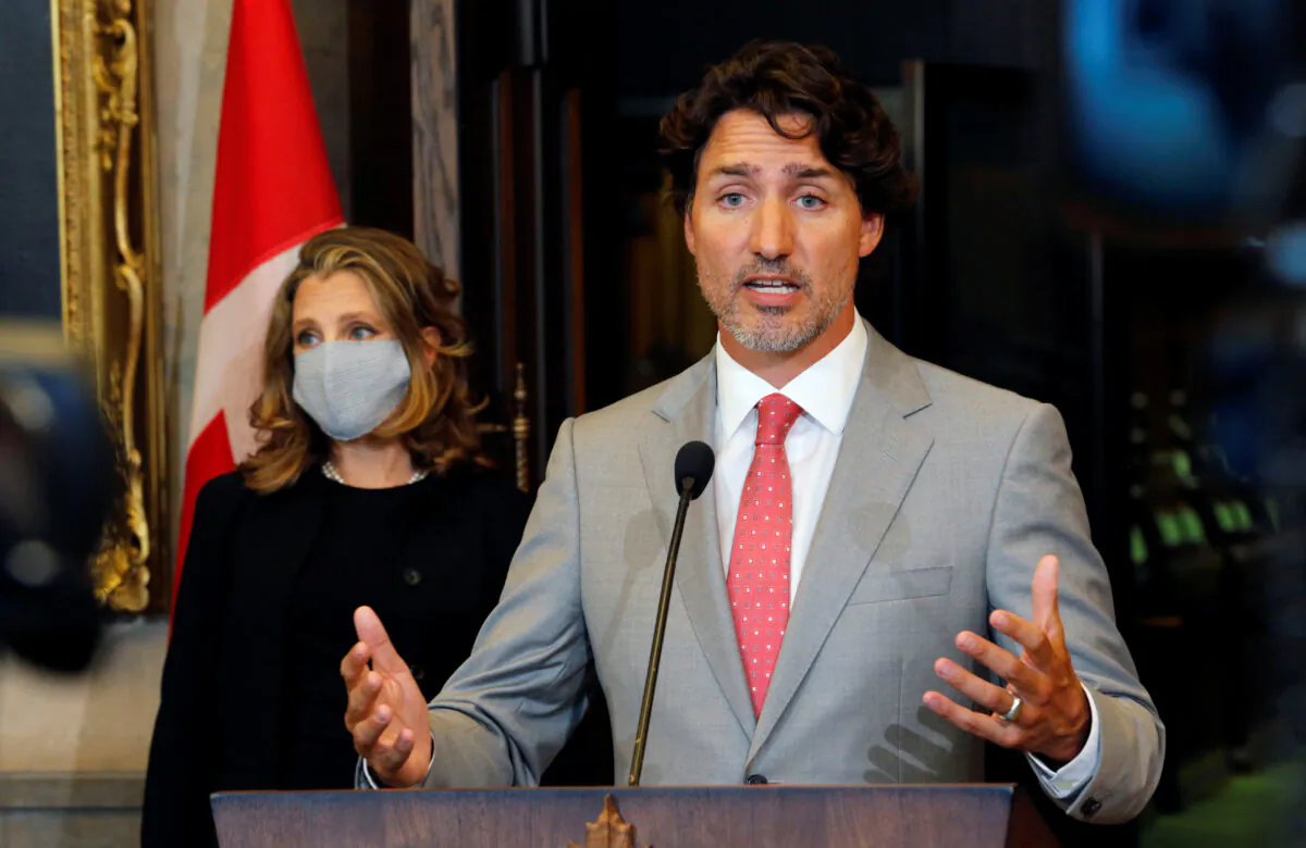 Canadian Prime Minister Justin Trudeau speaks to reporters next to Canadian Deputy Prime Minister and Finance Minister Chrystia Freeland on Parliament Hill in Ottawa on Aug. 18, 2020. (Reuters/Patrick Doyle)