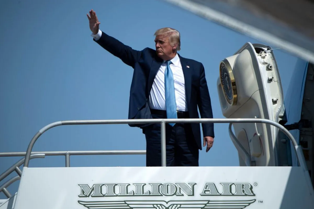 President Donald Trump waves as he boards Air Force One after a rally at Yuma International Airport, in Yuma, Arizona, on Aug. 18, 2020. (Brendan Smialowski/AFP via Getty Images)