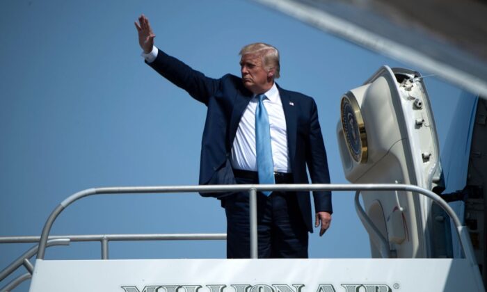 President Donald Trump waves as he boards Air Force One after a rally at Yuma International Airport, in Yuma, Arizona, on Aug. 18, 2020. (Brendan Smialowski/AFP via Getty Images)