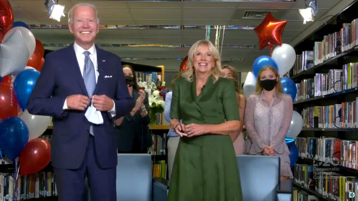 Joe Biden, accompanied by his wife Jill Biden, celebrates after being formally nominated as 2020 U.S. democratic presidential candidate in convention roll call during the virtual 2020 Democratic National Convention as participants from across the country are hosted over video links from the originally planned site of the convention in Milwaukee, Wisconsin, on Aug. 18, 2020. (2020 Democratic National Convention/Pool via Reuters)