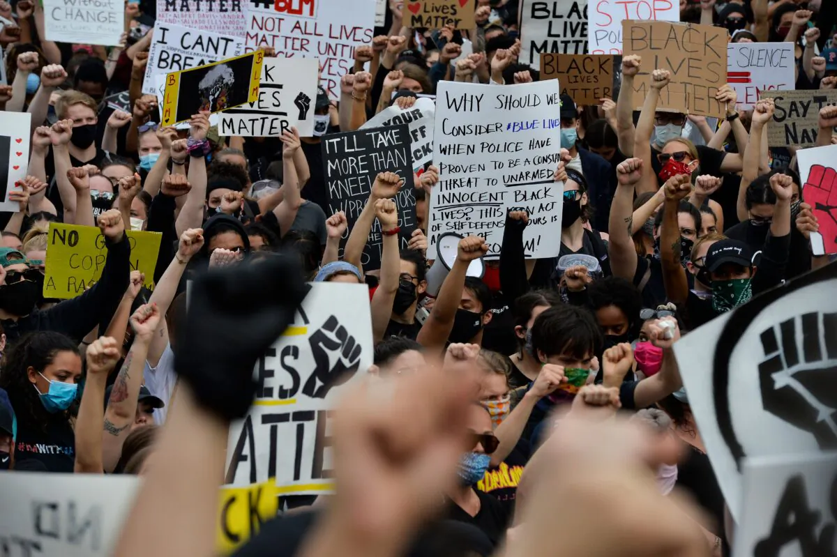 Protesters rally on the steps of the State House during a Black Lives Matter rally in Providence, R.I., on June 5, 2020. (Joseph Prezioso/AFP via Getty Images)