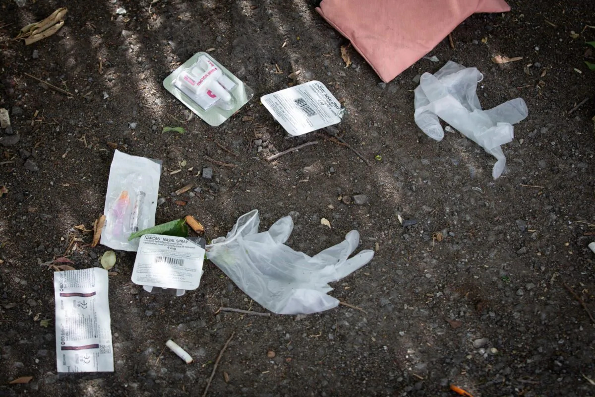 A drug syringe and nasal overdose prevention drug can be seen near a popular drug spot in Ottawa, Ontario, on June 25, 2020. (Lars Hagberg/AFP via Getty Images)