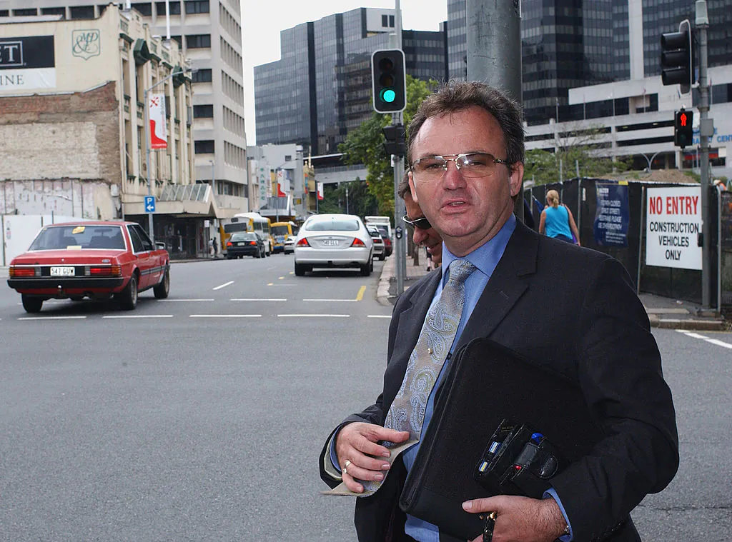 Convicted conman Peter Foster leaves Federal Court after facing charges by the Australian Competition and Consumer Commission on February 26, 2003 in Brisbane, Australia. (Darren England/Getty Images)
