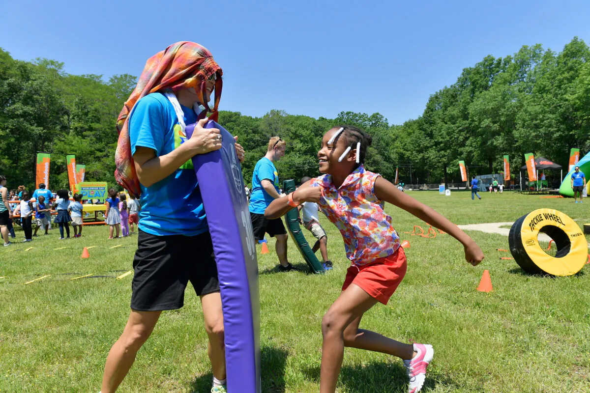 Hundreds of students from the Mattahunt Elementary School play at a park in Boston, Mass., on June 12, 2017. (Paul Marotta/Getty Images for Nickelodeon)