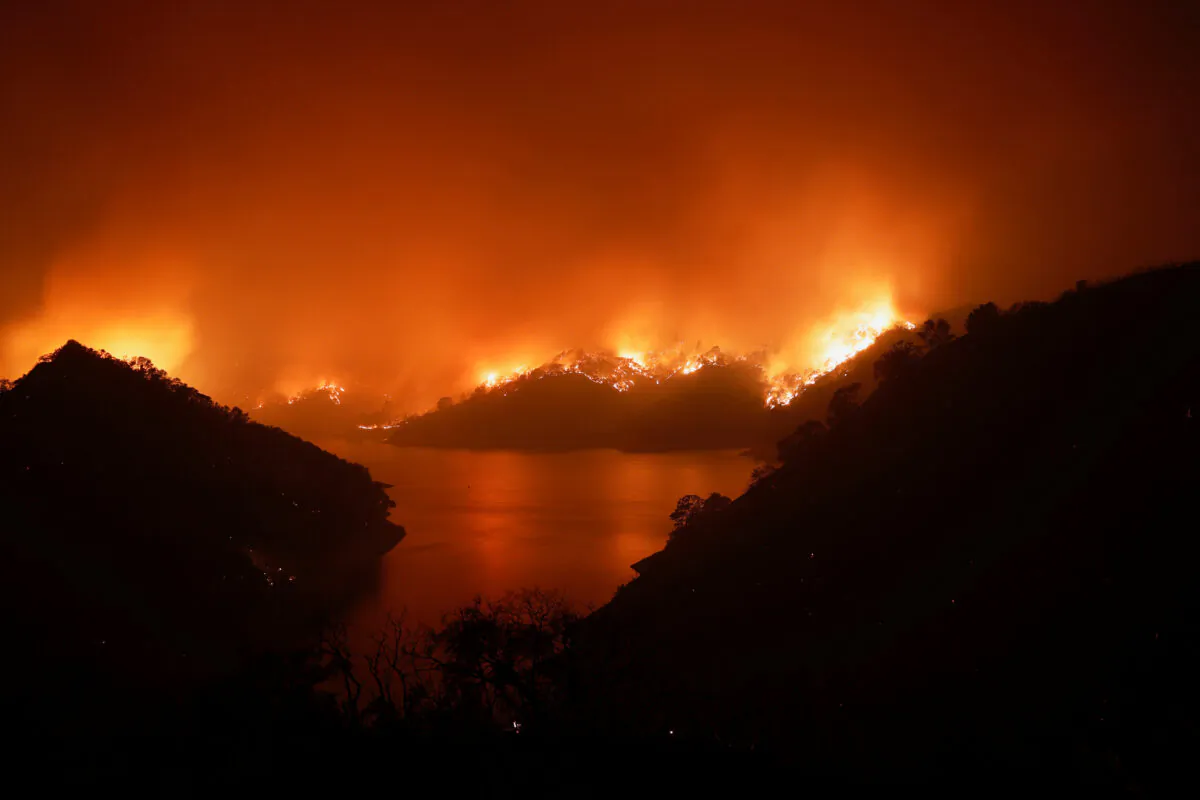 Flames are seen along the east side of Lake Berryessa during the LNU Lighting Complex Fire near Berryessa Highlands, Calif., on Aug 19, 2020. (Stephen Lam/Reuters)