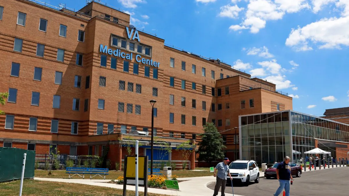 People walk outside the Louis A. Johnson VA Medical Center in Clarksburg, W.Va., on July 14, 2020. (Gene J. Puskar/AP Photo)