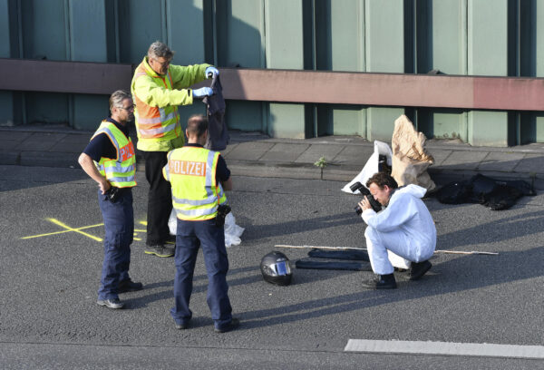 Police officers investigate on the city motorway A100 in Berlin