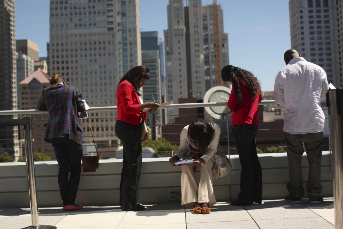 Job seekers apply for positions at a new Target retail store in San Francisco, Calif., on Aug. 9, 2012. (Robert Galbraith/Reuters)