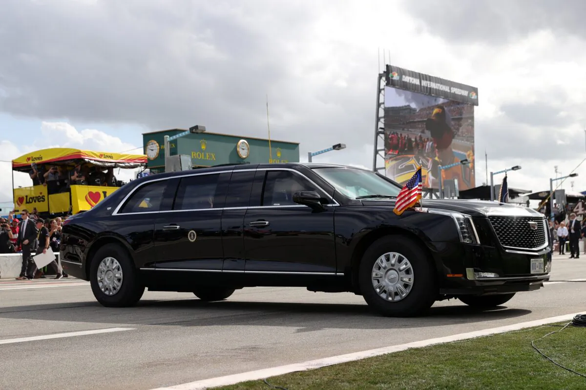 President Donald Trump and First Lady Melania Trump ride in the limousine, known as the Beast, on pit road prior to a NASCAR race in Daytona Beach, Fla., on Feb. 16, 2020. (Chris Graythen/Getty Images)