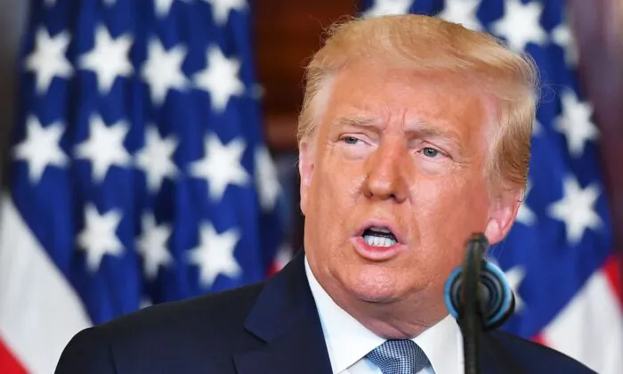 President Donald Trump speaks during the signing ceremony for a proclamation on the 100th anniversary of the ratification of the 19th Amendment in the Blue Room of the White House in Washington on Aug. 18, 2020. (Mandel Ngan/AFP via Getty Images)