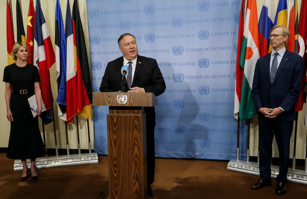 Secretary of State Mike Pompeo speaks to reporters following a meeting with members of the U.N. Security Council on Aug. 20, 2020, as U.S. Ambassador to the United Nations Kelly Craft and U.S. special representative for Iran Brian Hook listen. (Mike Segar/Pool via AP)