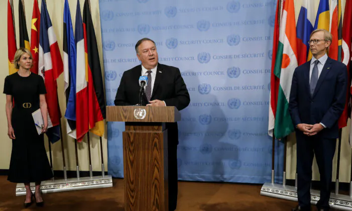 Secretary of State Mike Pompeo speaks to reporters following a meeting with members of the U.N. Security Council on Aug. 20, 2020, as U.S. Ambassador to the United Nations Kelly Craft and U.S. special representative for Iran Brian Hook listen. (Mike Segar/Pool via AP)