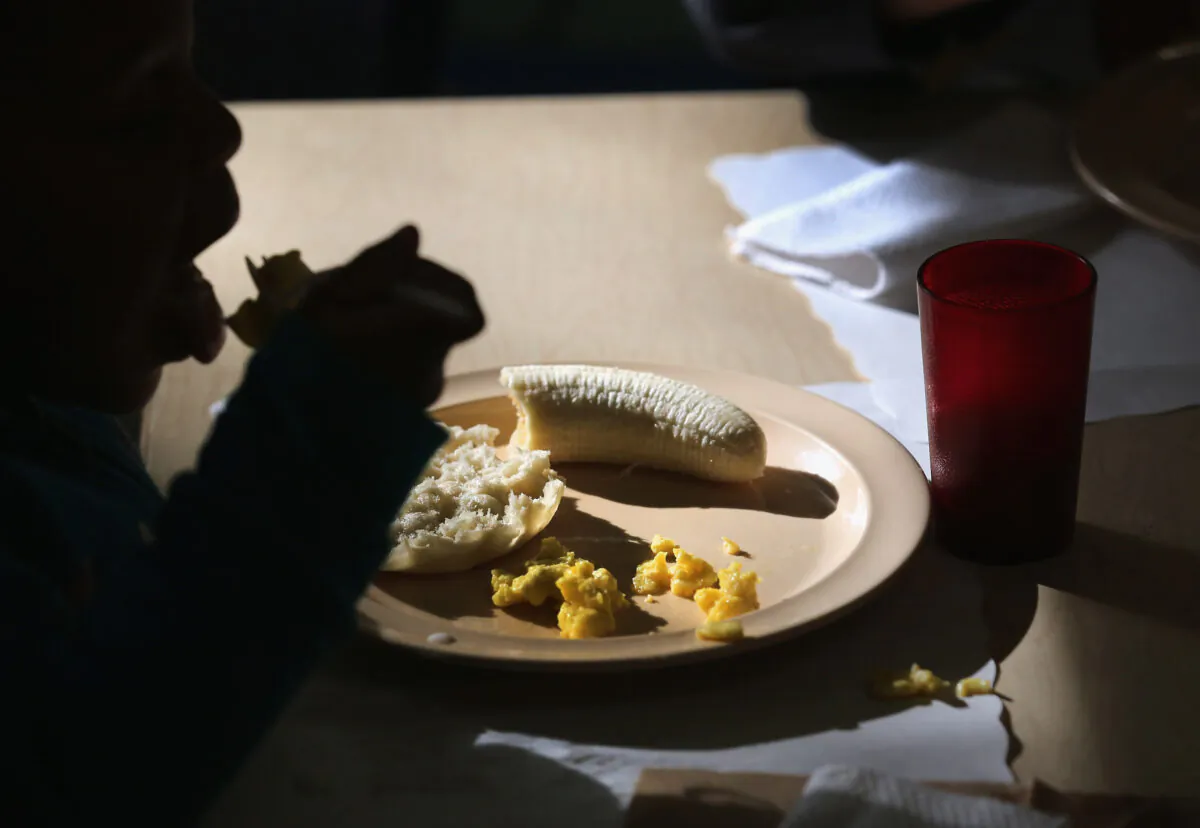 A child eats at the federally-funded Head Start Program school in this file photo. (John Moore/Getty Images)