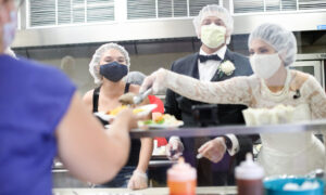 Newlyweds Donate and Serve Canceled Wedding Reception Food to a Local Women's Shelter