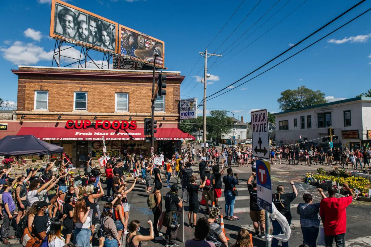 People participate in a demonstration against the city's plans to reopen an autonomous zone known as George Floyd Square, outside Cup Foods in Minneapolis, Minn., on Aug. 17, 2020. (Brandon Bell/Getty Images)
