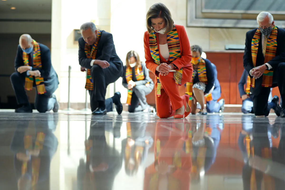 (L-R) Sen. Cory Booker (D-N.J.), Senate Minority Leader Charles Schumer (D-N.Y.), Sen. Kamala Harris and now Democratic vice president nominee (D-Calif.), Speaker of the House Nancy Pelosi (D-Calif.), Rep. Karen Bass (D-Calif.) and House Majority Leader Steny Hoyer (D-Md.) join fellow Democrats from the House and Senate kneel in silence for eight minutes and 46 seconds to honor George Floyd in the Capitol Visitors Center in District of Columbia on June 08, 2020. (Chip Somodevilla/Getty Images)