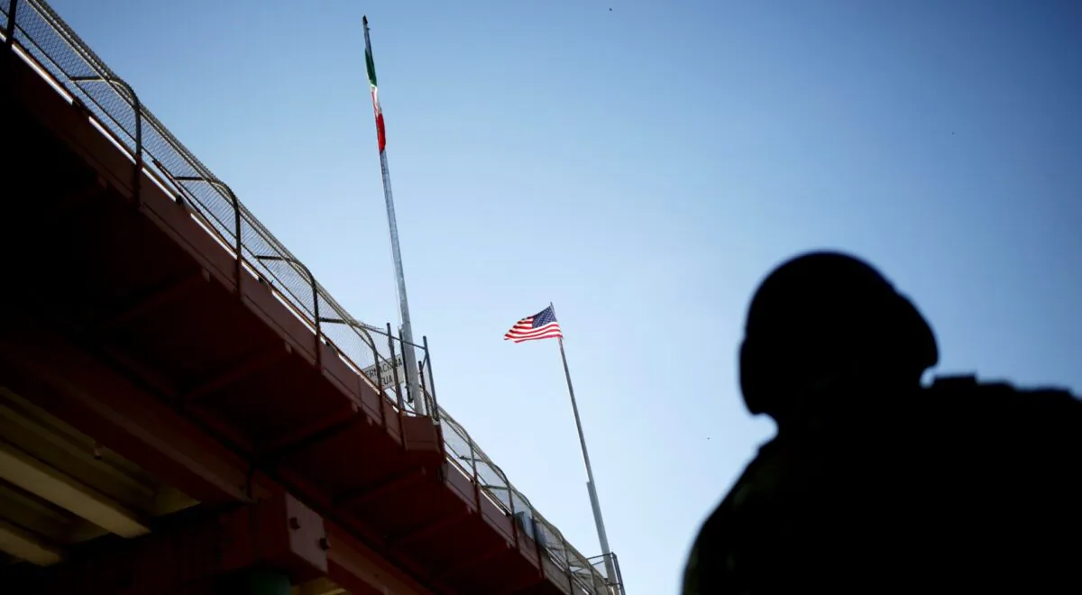 A U.S. flag and the Mexican flag are pictured on the international border bridge between El Paso, United States, and Ciudad Juarez, Mexico, on July 9, 2019. (Daniel Becerril/Reuters)