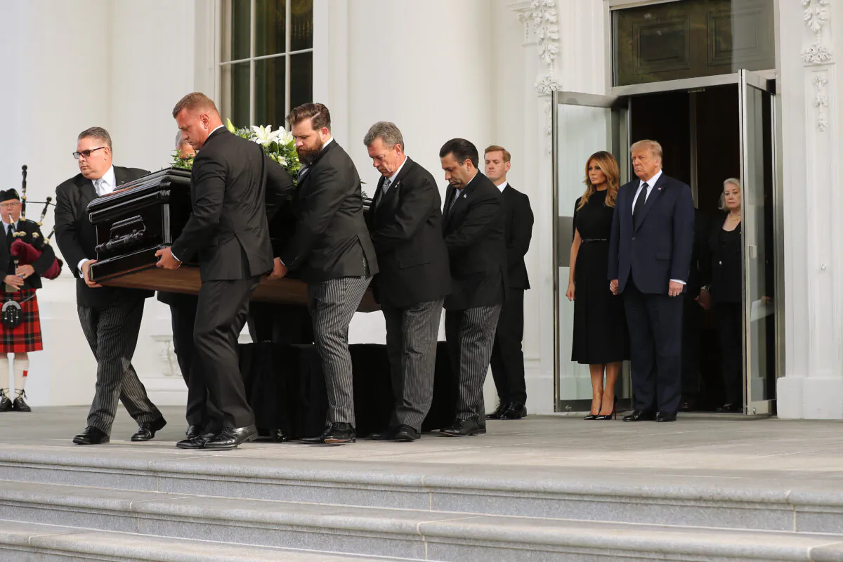 President Donald Trump and first lady Melania Trump follow his brother Robert Trump’s casket out of the White House following his funeral service in Washington on Aug. 21, 2020. (Chip Somodevilla/Getty Images)