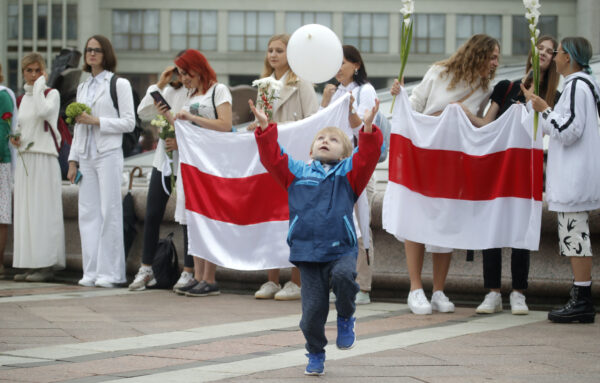 A boy catches a balloon during a protest in Minsk