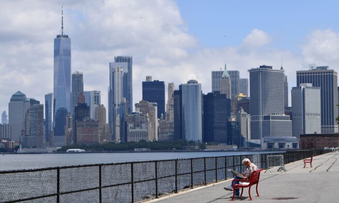 The Manhattan skyline in the distance as a man visits Governors Island in New York City, on July 15, 2020. (ANGELA WEISS/AFP via Getty Images)