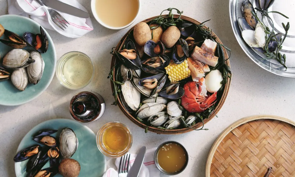 Eventide's smaller-scale, home kitchen-friendly clambake condenses the experience to a bamboo steamer basket set over a wok. (Zack Bowen)