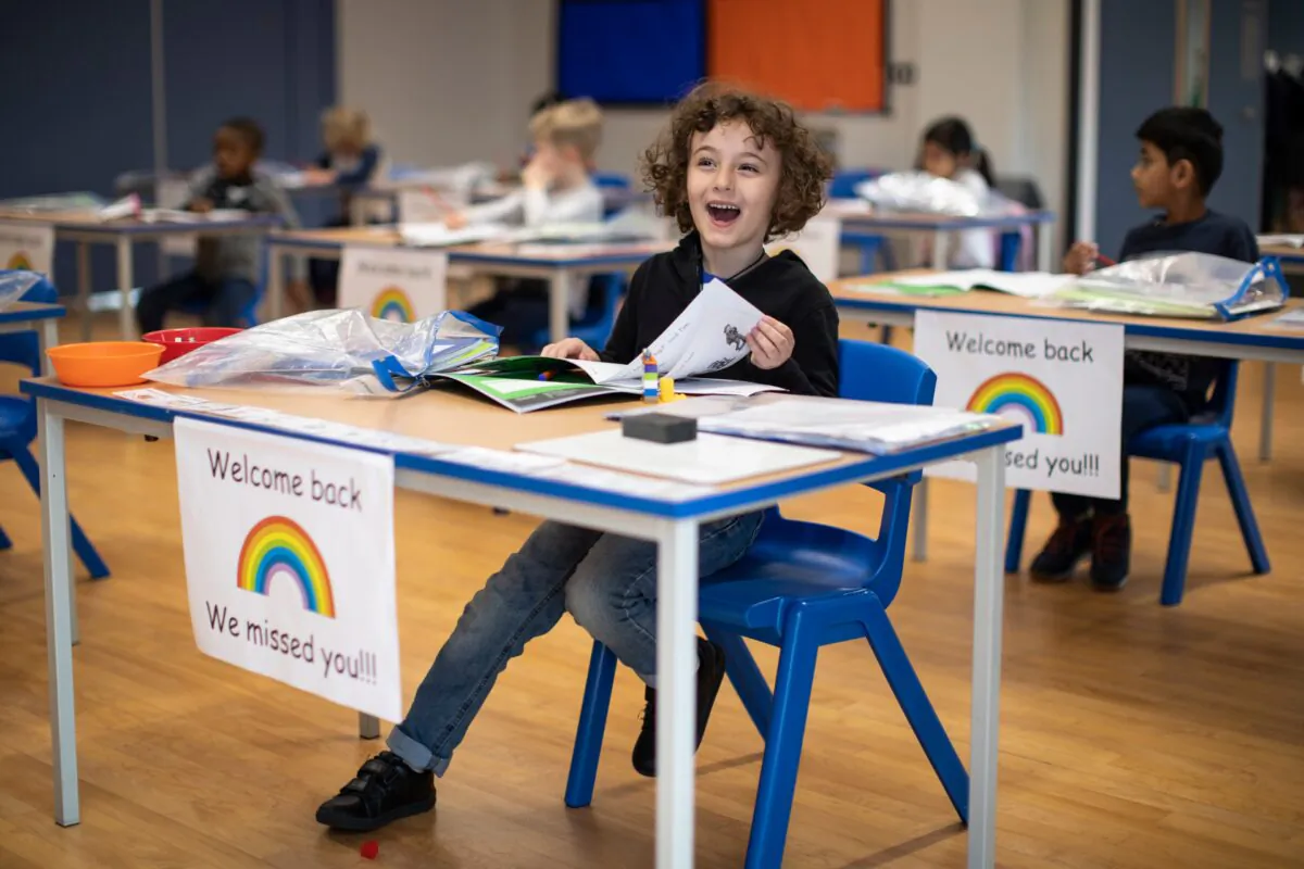 Children sit at individual desks during a lesson at the Harris Academy's Shortland's school in London on June 4, 2020. (Dan Kitwood/Getty Images)