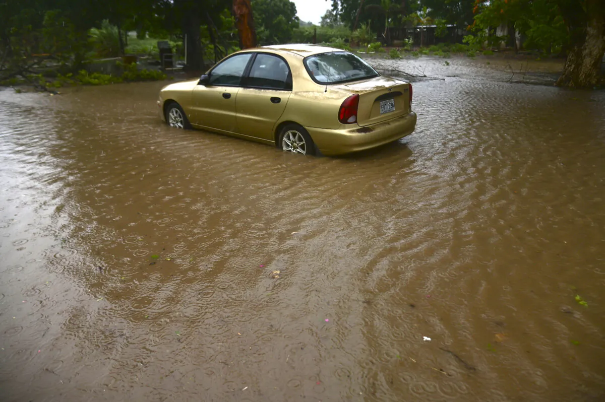 Various areas of the southern coast felt the effects of Tropical Storm Laura has it traveled west at about 18 miles per hour and with winds of 50 miles per hour, in Salinas, Puerto Rico, on Aug. 22, 2020. (Carlos Giusti/AP Photo)