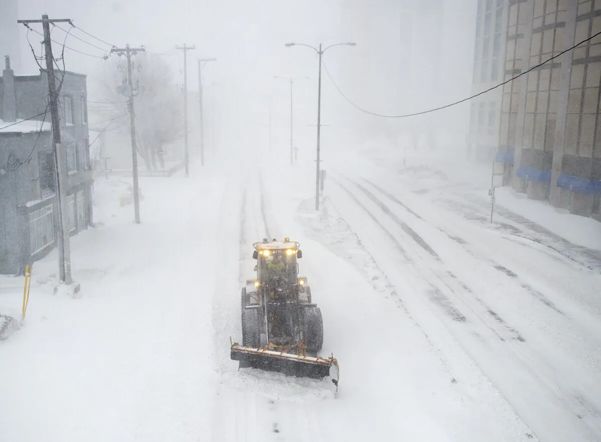 A snowplow clears a path in St. John’s during a state of emergency as blizzard conditions descend on the Newfoundland and Labrador capital on Jan. 17, 2020. (Andrew Vaughan/The Canadian Press)
