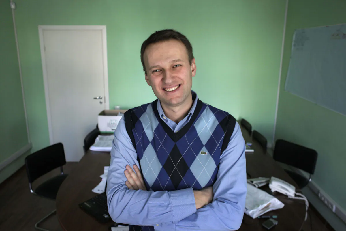 Then corporate lawyer Alexei Navalny poses in his office in Moscow, on March 17, 2010. (Alexander Zemlianichenko/AP Photo)