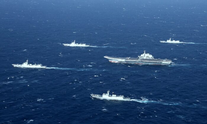 A formation of the Chinese Navy, including the aircraft carrier Liaoning (C), during a military exercise in the South China Sea on January 2, 2017.  (STR / AFP via Getty Images)