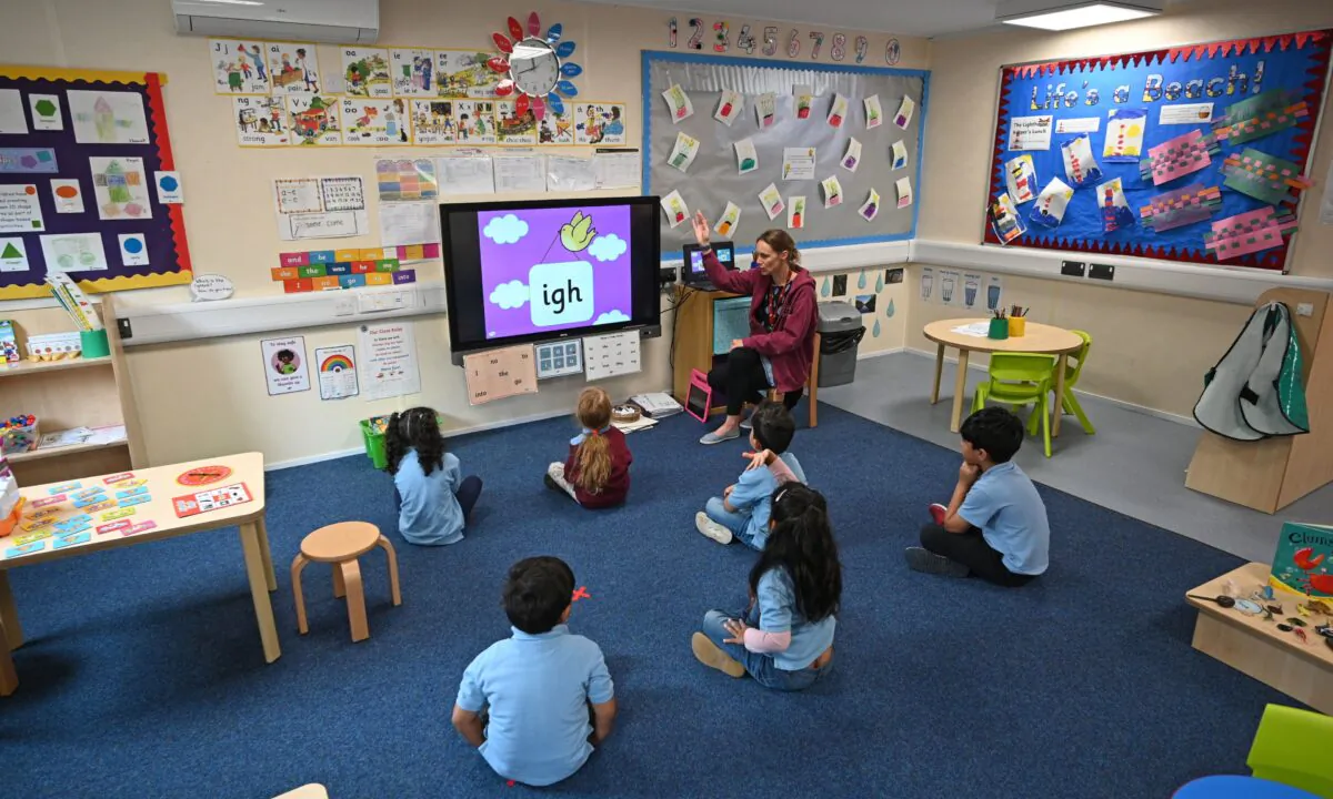 In a reception classroom, children sit apart from each other at Brambles Primary Academy in Huddersfield, England, on June 4, 2020. (Oli Scarff/AFP via Getty Images)
