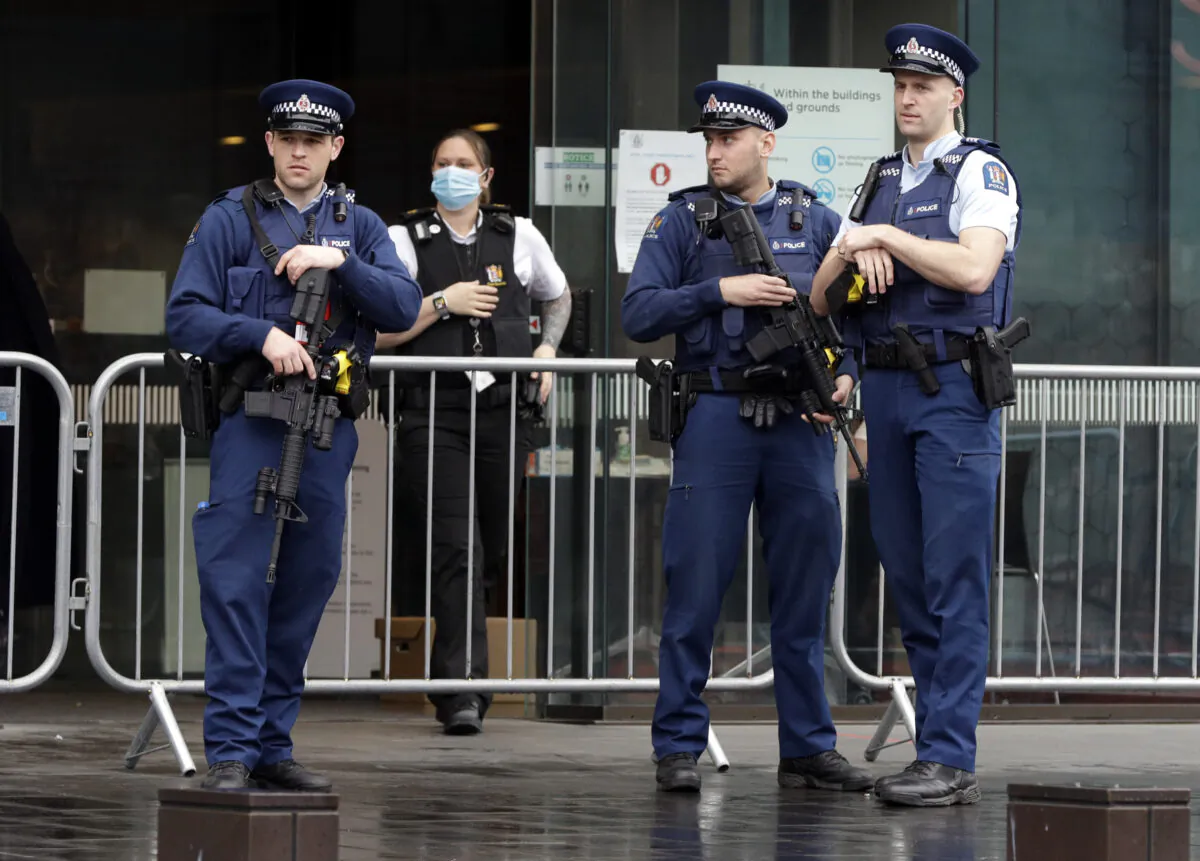 Police stand outside Christchurch High Court as family and survivors from the March 2019 Christchurch mosque shootings arrive for the sentencing of 29-year-old Australian Brenton Harrison Tarrant, in Christchurch, New Zealand on Aug. 24, 2020. (Mark Baker/AP)