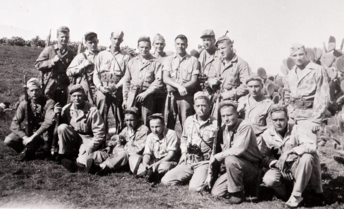 The "40 Thieves on Saipan." The platoon consisted of 40 Marines who served on the island of Saipan in WWII. (Standing L–R) Richard Knoll, Francis Moynihan, Barney Wheeless, Daniel Kenny, Ira Causey, Albert Malanga, Corporal Don Evans, Bill Emerick, Bernie Jones. (Seated L–R) Otto Hebel, Al Yunker, John Zuziak, Lonnie Jackson, Hal Moore, Wayland Stevens, Keith Clark, Sergeant Bill Knuppel. (Joseph Tachovsky Collection)