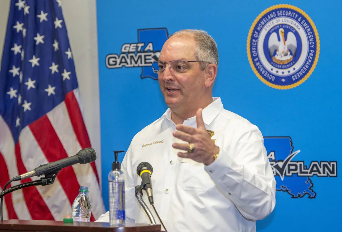 Louisiana Gov. John Bel Edwards answers questions while holding a media briefing about the state's activity related to Hurricanes Marco and Laura in Baton Rouge, La. on August 24, 2020. (Bill Feig./The Advocate via AP)