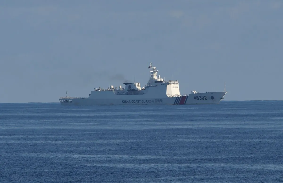 A Chinese coastguard ship sails along the area of a joint search and rescue exercise between Philippine and US coastguards near Scarborough shoal in the South China Sea on May 14, 2019. (TED ALJIBE/AFP via Getty Images)