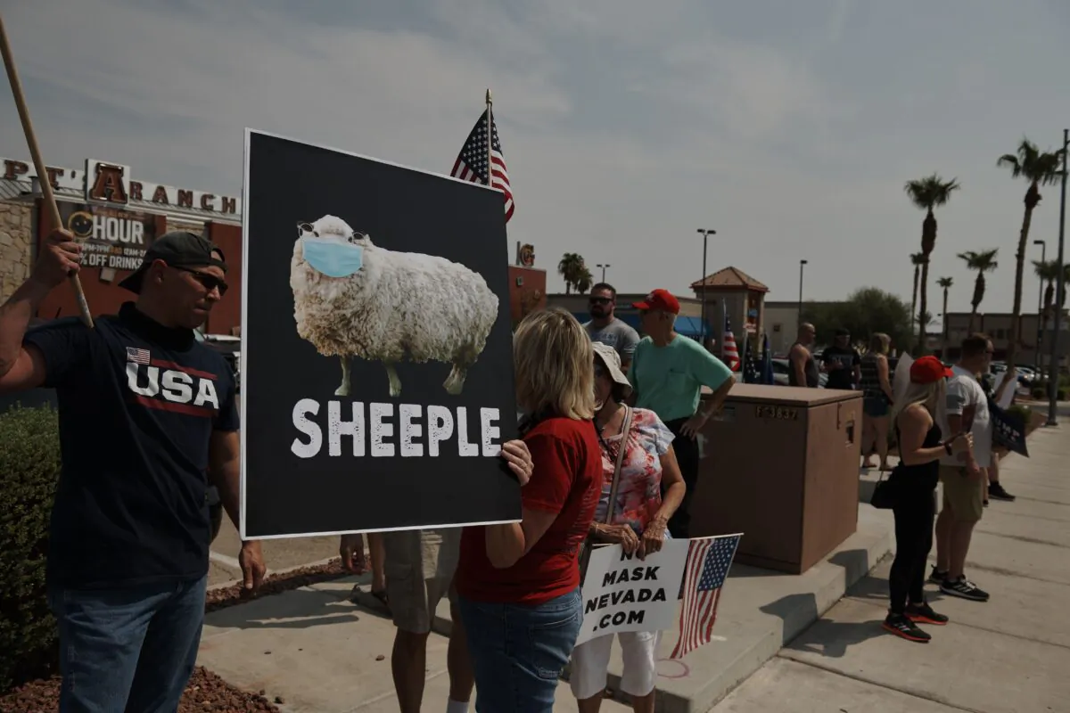 Protesters rally against a mask mandate, many showing support for President Donald Trump, in Las Vegas, Nev., on Aug. 22, 2020. "On day one" of his own presidency, Democratic presidential nominee Joe Biden said, he would implement a national COVID-19 plan and mandate mask wearing. (Bridget Bennett/AFP via Getty Images)