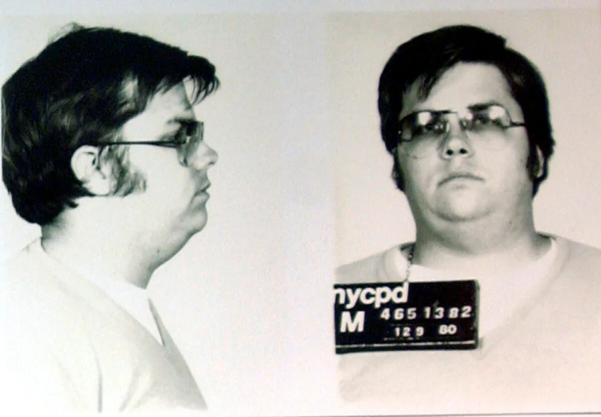 A mug-shot of Mark David Chapman, who shot and killed John Lennon, is displayed on the 25th anniversary of Lennon's death at the NYPD in New York Dec. 8, 2005. Chapman is currently imprisoned at Attica State Prison in New York, serving a 20-year-to-life sentence after pleading guilty to 2nd degree murder. (Chip East/Reuters/File Photo)