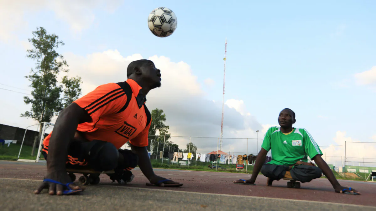 A victim of polio disease heads the ball during a game of para-soccer in Abuja, Nigeria Aug. 22, 2020. (Afolabi Sotunde/Reuters)