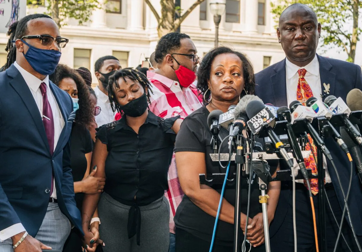 Julia Jackson (second from R), the mother of Jacob Blake, prepares to speak during a news conference with attorney Benjamin Crump (R) in Kenosha, Wis., on Aug. 25, 2020. (Brandon Bell/Getty Images)